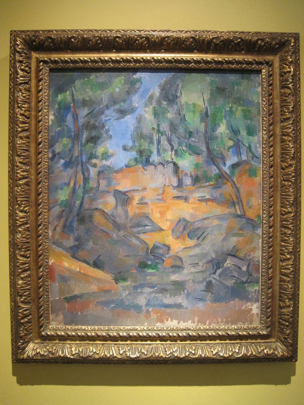 Reproduction du tableau « Arbres et rochers - Paul Cézanne » par Alpha Reproduction en peinture à l’huile