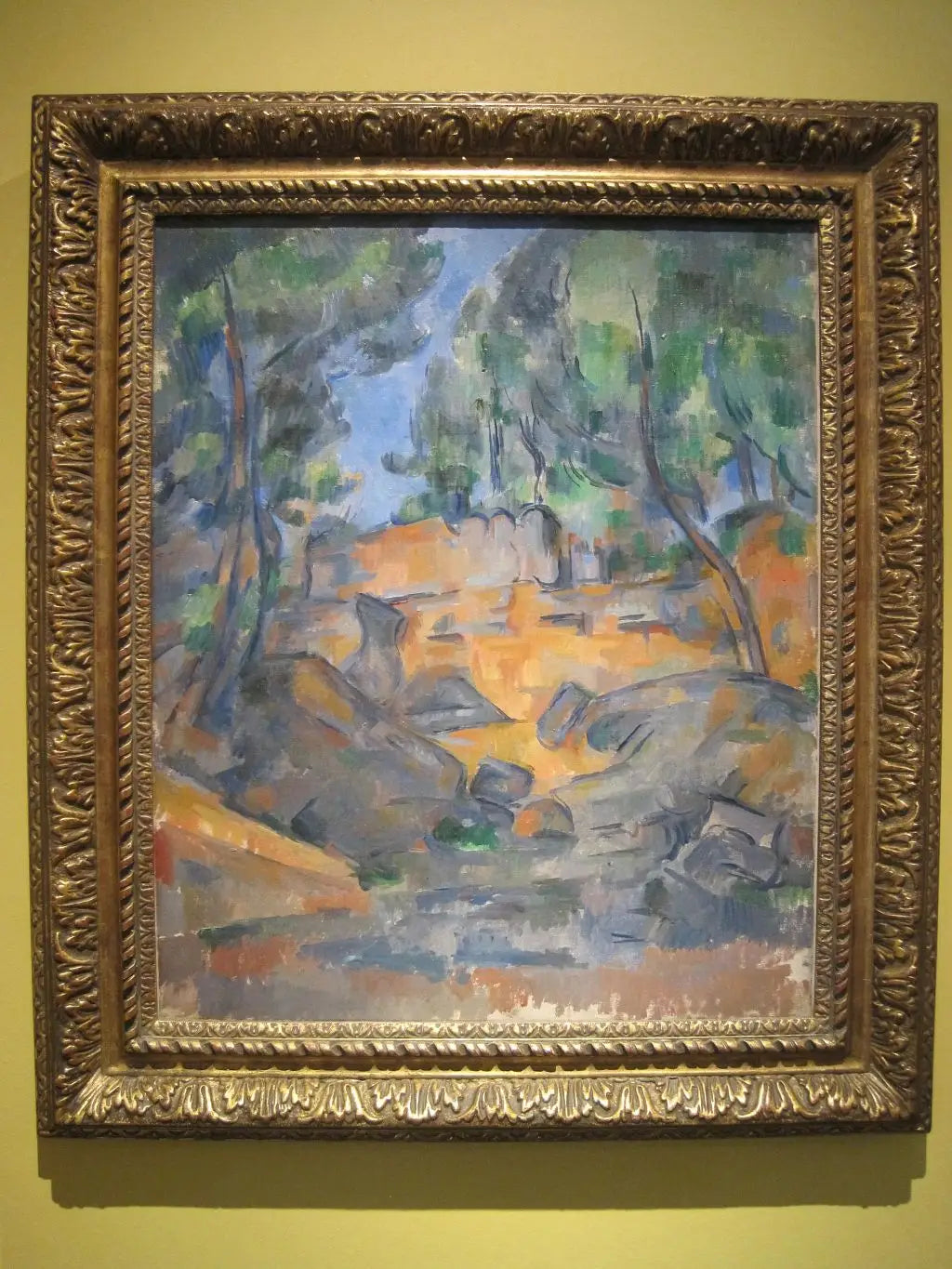 Reproduction du tableau « Arbres et rochers - Paul Cézanne » par Alpha Reproduction en peinture à l’huile