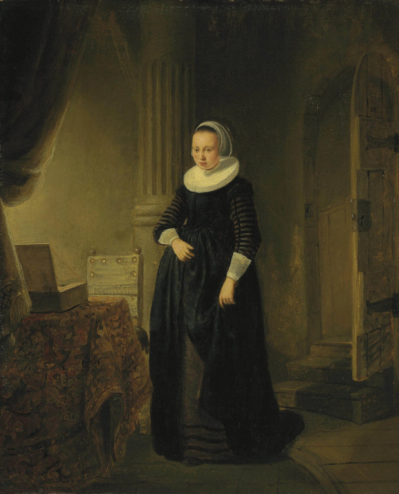 Porträt einer Frau, stehend in einem Innenraum - Rembrandt